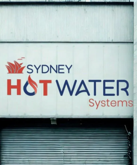 Our Process – Sydney Hot Water Systems logo with a stylised flame and Sydney skyline, displayed on a building facade.