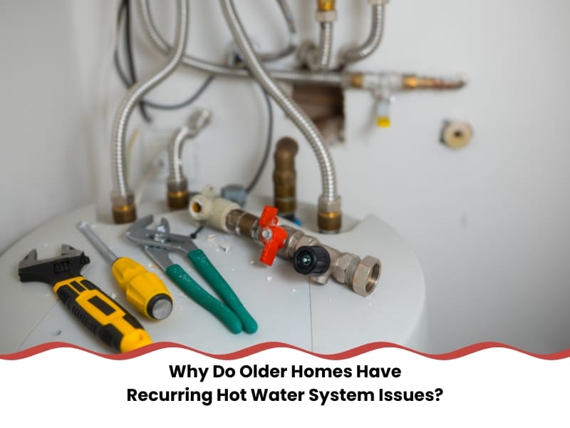Hot water system issues in older homes needing frequent repairs with tools on heater tank.