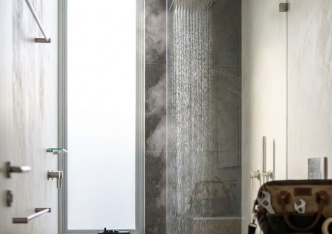 Gas continuous flow vs electric tank hot water systems compared for shower performance in a Sydney bathroom.