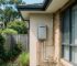 Modern gas hot water system installed outside a Sydney home