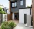 Heat pump hot water system in a Sydney townhouse courtyard
